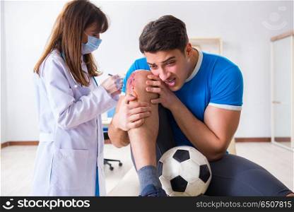 Football soccer player visiting doctor after injury