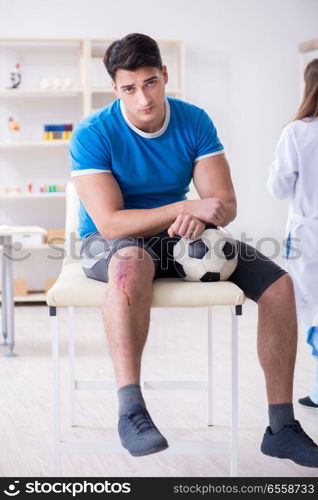 Football soccer player visiting doctor after injury