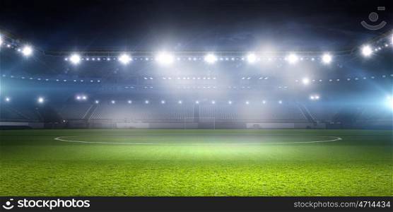 Football stadium in lights. Background image of empty soccer green field
