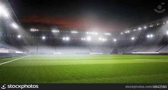 Football stadium in lights. Background image of empty soccer green field