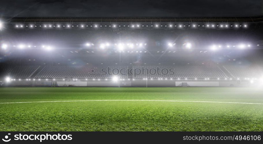 Football stadium in lights. Background image of empty soccer green field