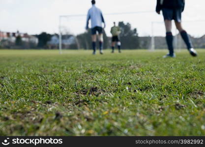 Footballers on a pitch