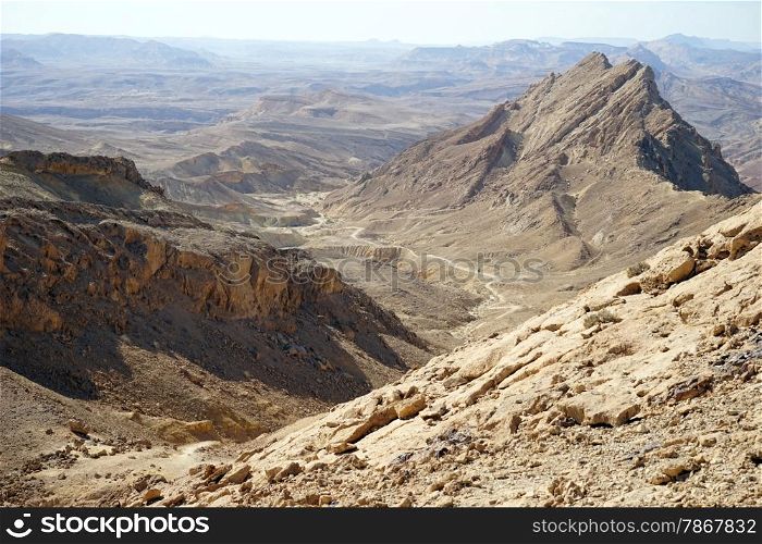 Footpath and crater Ramon in Negev desert, Israel