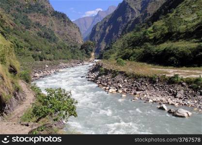 Footpath and mountain river near Manaslu in Nepal