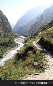 Footpath near river in Manaslu region in Nepal