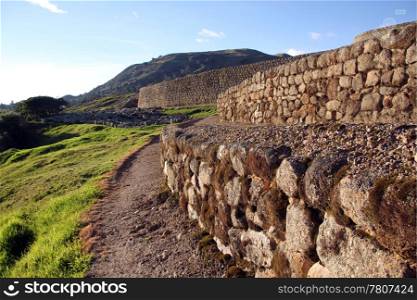 Footpath near the wall of fortress in Ingapirca in Ecuador