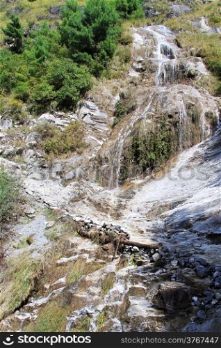 Footpath near waterfall in mountain in Nepal