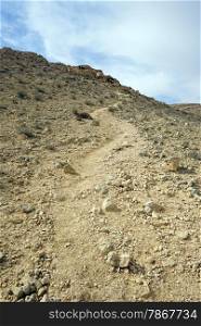 Footpath on the slope of mount in Negev desert, Israel