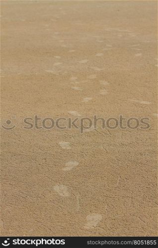 Footprint on sand beach in summer, abstract nature background