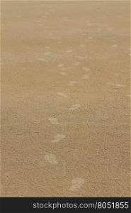 Footprint on sand beach in summer, abstract nature background