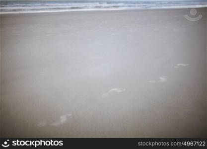 Footprints in the sand at beach