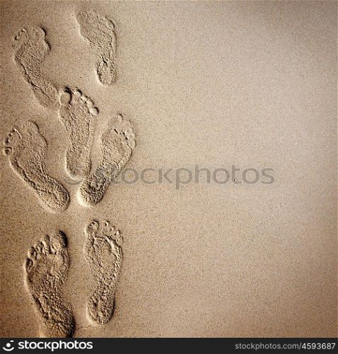 Footprints in the sand. Beach background with footprints in the sand