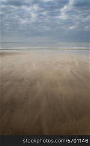 Footprints on empty beach Summer landscape
