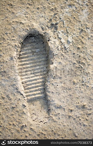 Footstep pattern seen on a concrete background