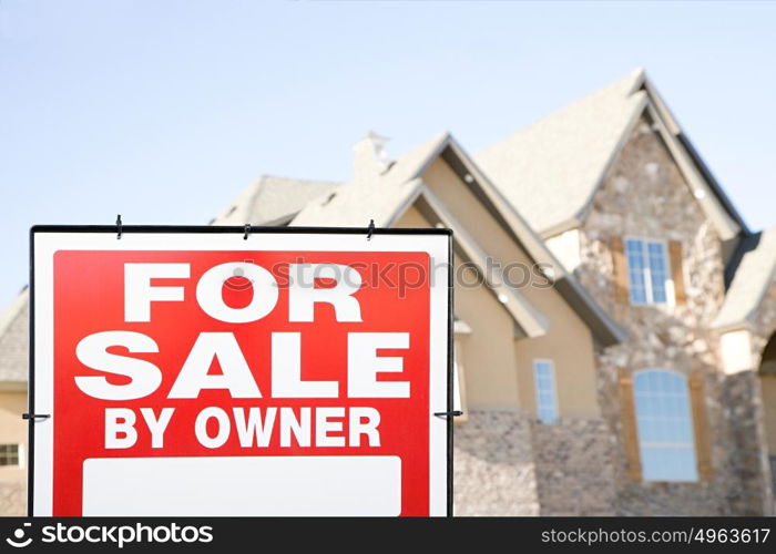 For sale sign and a house