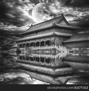 Forbidden City is the largest palace complex in the world. Located in the heart of Beijing. In the evening by the light of the moon. black and white photography. Forbidden City