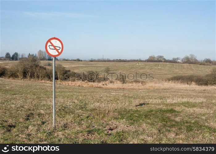 Forbidden tank sign on a restricted area field