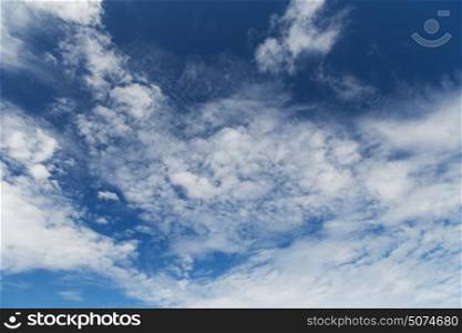 forecast, weather, skyscape and meteorology concept - blue cloudy sky. blue cloudy sky