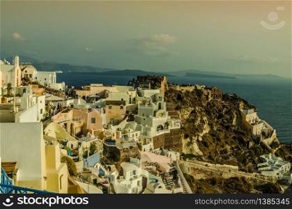 foreground of fira village and in the background the aegean sea with its islands during a sunset. Santorini. Greece