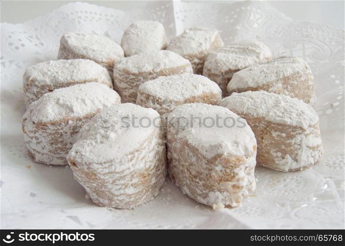 Foreground white cookies presented in a tray. Foreground traditional white cookies presented in a tray