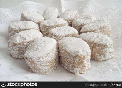 Foreground white cookies presented in a tray. Foreground traditional white cookies presented in a tray