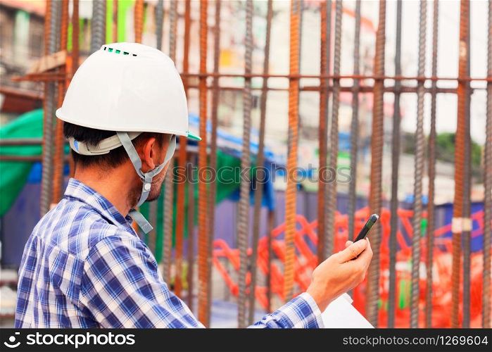 Foreman for construction control, use phone to communicate with staff