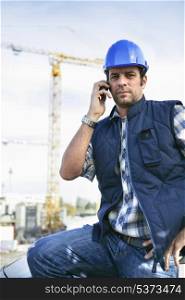 foreman in construction site making a call
