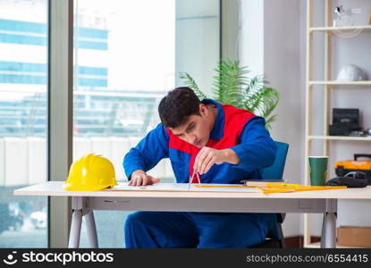 Foreman looking at construction plan