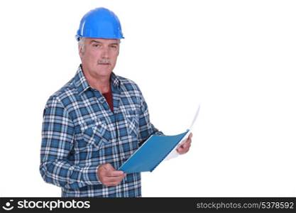 Foreman looking through paperwork