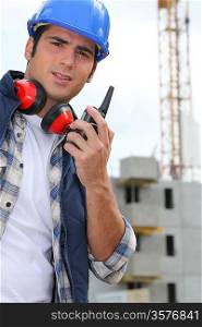 Foreman with radio on site