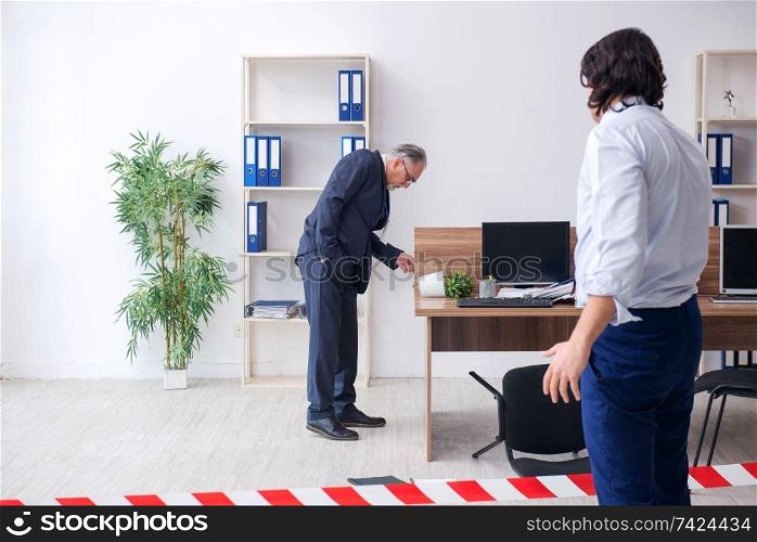 Forensic investigator investigating theft in the office