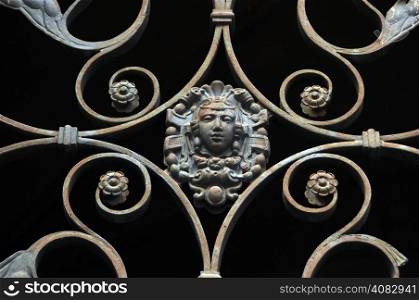 forged iron gate vintage face ornament decoration