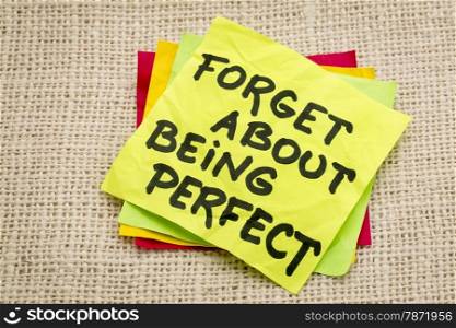 forget about being perfect - advice on a sticky note against burlap canvas