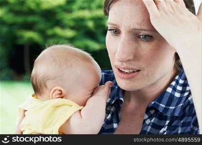 Forgetful Mother Holding Baby Girl At Home