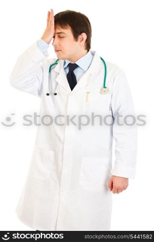Forgot something medical doctor holding his hand near forehead isolated on white&#xA;