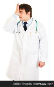 Forgot something medical doctor holding his hand near forehead isolated on white&#xA;