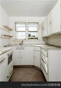 Forgotten empty abandoned dirty kitchen.