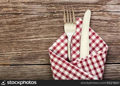 fork and knife as utensils on wooden table