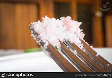 Fork sugar crystals. Macro image with sugar crystals on a fork