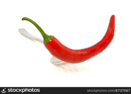 fork with red chili pepper on white background