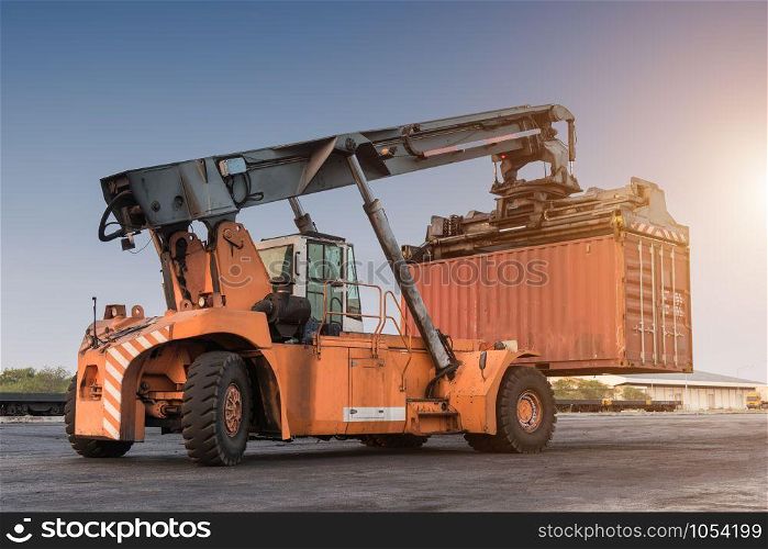 Forklift handling container box loading at the Docks with Truck