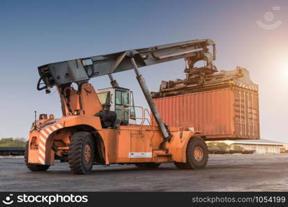 Forklift handling container box loading at the Docks with Truck