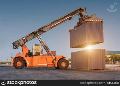 forklift handling holding container box at harbor logistic zone
