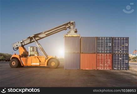Forklift handling the containers box in the port at Thailand