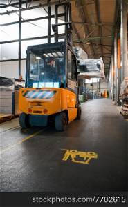 Forklift loader in storage warehouse shipyard. Distribution products. Delivery. Logistics. Transportation. Business background. High quality photo. Forklift loader in storage warehouse ship yard. Distribution products. Delivery. Logistics. Transportation. Business background