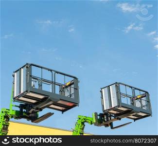 Forklift telescopic boom with buckets and aerial working platform.