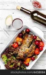 Form baked meat loaf of veal with plum sauce,seasoning and wine
