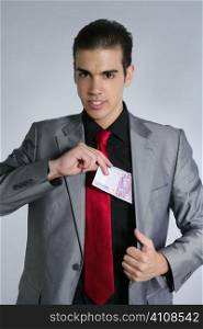 Formal young businessman portrait with 500 euro note on gray background