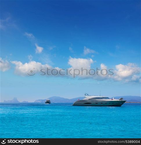Formentera boats with Ibiza Es Vedra background in Balearic islands