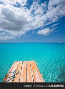 Formentera Ses Illetes beach pier Illetas with Ibiza background at balearic islands